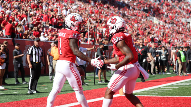 Utah Utes cornerback Clark Phillips III (1) shakes hands with cornerback JaTravis Broughton (4) after making his third interception of the game against the Oregon State Beavers at Rice-Eccles Stadium.